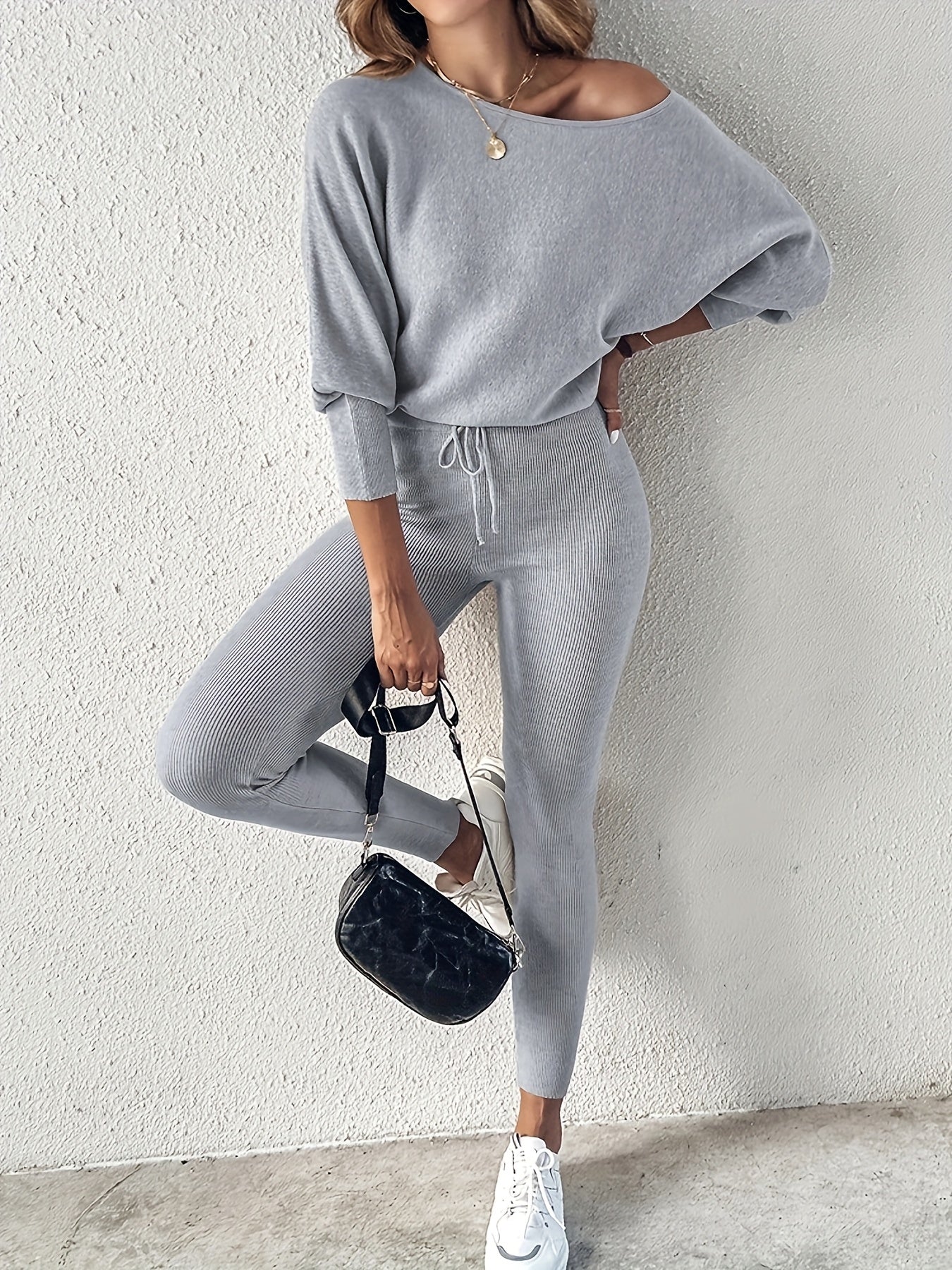 Casual Two-Piece Outfit Featuring A Long-Sleeve Pullover And High-Waisted Drawstring Pants