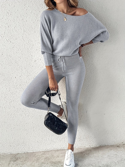 Casual Two-Piece Outfit Featuring A Long-Sleeve Pullover And High-Waisted Drawstring Pants