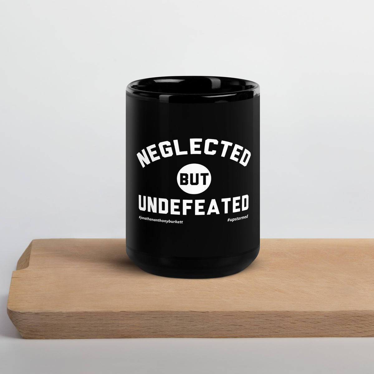 Neglected but Undefeated Upstormed Black Glossy Mug